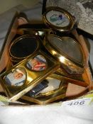 A quantity of small brass photograph frames.