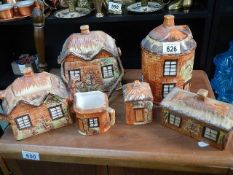 A cottage ware teapot, biscuit barrel etc.,