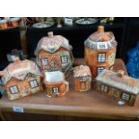 A cottage ware teapot, biscuit barrel etc.,