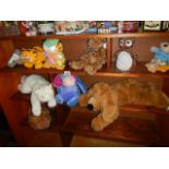 A mixed lot of soft toys including Eeyore, Garfield etc.,