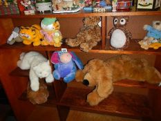 A mixed lot of soft toys including Eeyore, Garfield etc.,