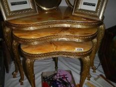 A nest of three gilt tables with marble tops. (Collect only)