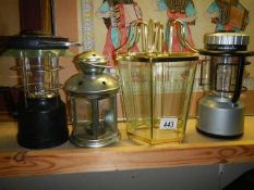 A candle lantern, two other lanterns and a lamp shade. (Collect only)
