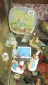 A collection of Peter Rabbit figures etc.,