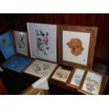 A quantity of framed and glazed cross stitch pictures.