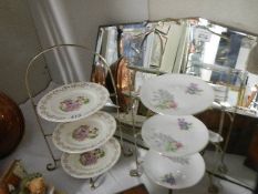 Two three tier cake stands with china plates.