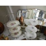Two three tier cake stands with china plates.