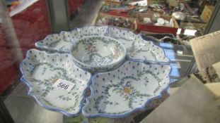 A hand painted set of hors d'ouvre dishes.