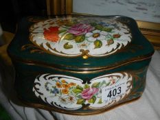 A floral decorated porcelain trinket box.