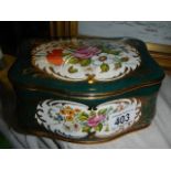A floral decorated porcelain trinket box.