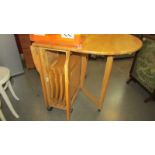 A modern drop leaf dining table. (Collect only)