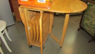 A modern drop leaf dining table. (Collect only)