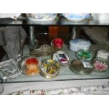 A quantity of glass paperweights.