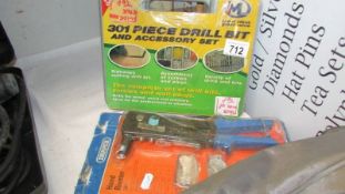 A new 301 piece drill bit set and a hand riveter.