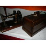 A cased vintage Jones sewing machine.
