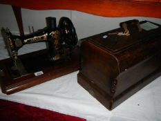 A cased vintage Jones sewing machine.