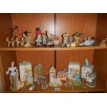 A mixed lot of ornaments including cottages, birds, figures etc., (Collect only)
