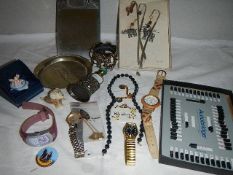 A mixed lot including scent bottle, badges, watches etc.,