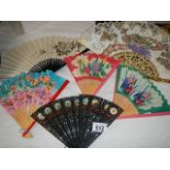 A quantity of vintage fans.