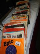 A quantity of 45 rpm records.