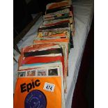 A quantity of 45 rpm records.