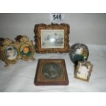 A quantity of miniature vintage photograph frames.
