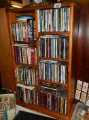 A large lot of CD's with shelf. (Collect only)