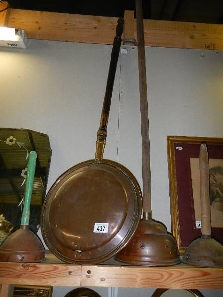 A copper warming pan and three copper washing dollies. (Collect only)