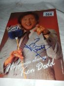 A signed photograph of Ken Dodd.