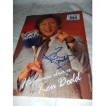 A signed photograph of Ken Dodd.