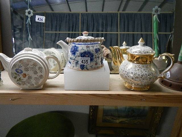 Three vintage teapots.