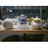 Three vintage teapots.