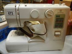 A Janome electric sewing machine, missing foot pedal. (collect only)