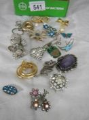 A mixed lot of vintage brooches etc.,