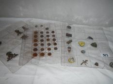 A quantity of old coins and badges.