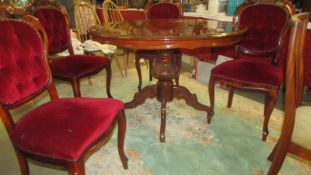 A good quality Italian circular dining table with four chairs. (Collect only)