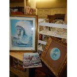 A framed and glazed picture of an American Indian, one other and a book.