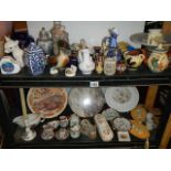 Two shelves of ceramic items including figures, plates etc., (collect only)