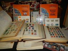 A quantity of albums of assorted stamps.