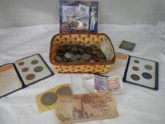 A mixed lot of coins and bank notes.