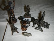 A tennis player pencil sharpener, Eiffel tower model etc.,