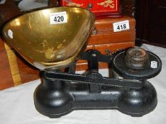 A set of vintage kitchen scales with brass pan.