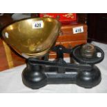 A set of vintage kitchen scales with brass pan.