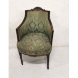 Edw. Mahogany Armchair, with curved pediment over a green floral fabric covered back, on tapered