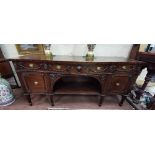 Large 19thC Mahogany Sideboard - serpentine shaped – with three apron drawers – decorated with