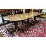 Early 20thC Triple Pedestal Dining Table, with oval ends, brass lions paw toes, castors, extends