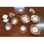 8 Place Setting “Brocade” Minton Teaset, red with gold floral detail (35 pieces), as new