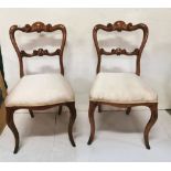 Pair of Victorian Rosewood Side Chairs, with shaped top rails, cream satin covered seats, cabriole