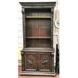 Early 20thC “Black Forest” Dark Oak Open-Top Floor Bookcase, a carved pediment over 3 adjustable