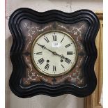 French Vineyard Wall Clock, with a shell appliqué inlay on a serpentine shaped and ebonised clock